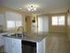 This is a spacious kitchen and dining room combo with tile flooring and lots of natural light at 7929 Palace Monaco Ave, Las Vegas, NV 89117