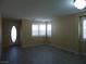 Inviting living room featuring wood floors, natural light, and neutral walls at 7929 Palace Monaco Ave, Las Vegas, NV 89117