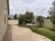 Serene backyard with a custom water feature and concrete patio area at 8212 Calico Wind St, Las Vegas, NV 89131