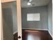 Bedroom with wood floor, ceiling fan and light, and natural light from window at 8212 Calico Wind St, Las Vegas, NV 89131