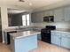 Well-equipped kitchen with modern appliances and ample counter space at 8212 Calico Wind St, Las Vegas, NV 89131