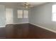 Bright and airy living room featuring hardwood floors and large windows at 8212 Calico Wind St, Las Vegas, NV 89131