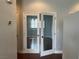 Bright room with natural light shining through glass French doors and dark wood floors at 8212 Calico Wind St, Las Vegas, NV 89131