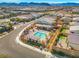 Aerial shot featuring the community pool, clubhouse, and surrounding neighborhood at 9032 Skye Canyon Ranch St, Las Vegas, NV 89166