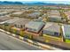Aerial view of the neighborhood with well-maintained lawns and beautiful mountain views at 9032 Skye Canyon Ranch St, Las Vegas, NV 89166