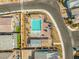 Aerial view featuring the community pool, neighborhood street, and other homes at 9032 Skye Canyon Ranch St, Las Vegas, NV 89166