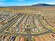 Wide aerial view of a residential area, showcasing the community layout and surrounding landscape at 9032 Skye Canyon Ranch St, Las Vegas, NV 89166