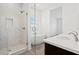 Modern bathroom with walk-in shower, soaking tub, and double sink vanity at 9032 Skye Canyon Ranch St, Las Vegas, NV 89166