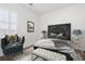 Inviting bedroom featuring a modern decor, art, and comfortable seating at 9032 Skye Canyon Ranch St, Las Vegas, NV 89166