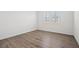 A bedroom with light-colored wood flooring and shuttered windows at 9032 Skye Canyon Ranch St, Las Vegas, NV 89166