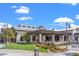 Skye Canyon community center with an inviting patio area, lush landscaping, and scenic views at 9032 Skye Canyon Ranch St, Las Vegas, NV 89166