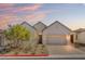 Charming single-story home with a brick driveway and desert landscaping at 9032 Skye Canyon Ranch St, Las Vegas, NV 89166