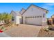 A well-maintained home with a paved driveway and a two-car garage at 9032 Skye Canyon Ranch St, Las Vegas, NV 89166