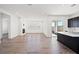 An open concept living room with hardwood floors and ample natural light at 9032 Skye Canyon Ranch St, Las Vegas, NV 89166