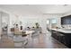 Open concept floor plan featuring modern living, dining, and kitchen area at 9032 Skye Canyon Ranch St, Las Vegas, NV 89166