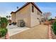 Wide shot of a large backyard with patio, hardscape, and small zero-scaped area at 9204 Brownstone Ledge Ave, Las Vegas, NV 89149