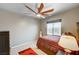 Bedroom with a large window that provides natural light and an overhead ceiling fan at 9204 Brownstone Ledge Ave, Las Vegas, NV 89149