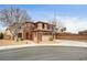 Beautiful two-story home with a brick and stucco facade, showcasing a well-manicured front yard at 9204 Brownstone Ledge Ave, Las Vegas, NV 89149