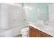 Bathroom featuring a tub-shower combo with a white shower curtain and a vanity with a sink at 9823 Lime Tree St, Las Vegas, NV 89178