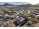 Beautiful aerial view of a desert neighborhood with lush trees nestled against mountain views at 10129 Elk Valley St, Las Vegas, NV 89178