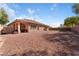 Spacious backyard with a covered patio and low maintenance desert landscaping at 10129 Elk Valley St, Las Vegas, NV 89178