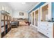 Stylish bedroom with blue accent wall, bunk beds, and French doors at 10129 Elk Valley St, Las Vegas, NV 89178