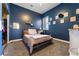 This bedroom offers plush carpeting, modern decor, and a cozy feel at 10129 Elk Valley St, Las Vegas, NV 89178