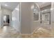 Inviting hallway with neutral tones, tile flooring, columns and archways providing a sense of openness at 10129 Elk Valley St, Las Vegas, NV 89178