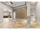 Bright living space with tile flooring, neutral walls, and a partial view into the adjacent Gathering room at 10129 Elk Valley St, Las Vegas, NV 89178