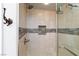 Bathroom features a glass shower with tiled accent and modern fixtures at 10288 Grizzly Forest Dr, Las Vegas, NV 89178
