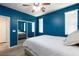 Bedroom features a ceiling fan, carpet floors, and mirror closet doors at 10288 Grizzly Forest Dr, Las Vegas, NV 89178