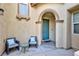 Inviting front entryway with seating area and arched doorway at 10288 Grizzly Forest Dr, Las Vegas, NV 89178