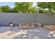 Charming backyard fire pit with stone seating area, perfect for outdoor gatherings and relaxation at 10288 Grizzly Forest Dr, Las Vegas, NV 89178