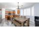 Open kitchen and dining area with wood cabinets, stainless appliances and wood flooring at 10288 Grizzly Forest Dr, Las Vegas, NV 89178