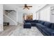View of open concept floorplan between living room, stairwell and kitchen at 10288 Grizzly Forest Dr, Las Vegas, NV 89178