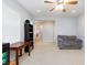 Comfortable living room featuring a neutral palette, ceiling fan, and comfortable sofa at 10288 Grizzly Forest Dr, Las Vegas, NV 89178