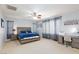 Spacious main bedroom with carpet flooring, ceiling fan, and generous natural light at 10288 Grizzly Forest Dr, Las Vegas, NV 89178