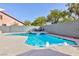 Inviting swimming pool with water features and a relaxing spa for ultimate outdoor enjoyment at 10288 Grizzly Forest Dr, Las Vegas, NV 89178