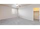Large carpeted bedroom featuring a ceiling fan and lots of natural light at 10956 Hunting Hawk Rd, Las Vegas, NV 89179