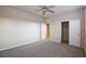 This bedroom has neutral walls and carpet and features two doors, one to a closet at 10956 Hunting Hawk Rd, Las Vegas, NV 89179