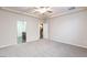 Large bedroom featuring carpet, ceiling fan, and ensuite bathroom at 10956 Hunting Hawk Rd, Las Vegas, NV 89179