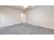 Spacious carpeted bedroom with a ceiling fan and neutral walls at 10956 Hunting Hawk Rd, Las Vegas, NV 89179