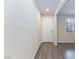Entryway with wood-look floors and a view into the adjacent living space at 10956 Hunting Hawk Rd, Las Vegas, NV 89179