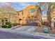 Charming two-story home showcases manicured landscaping, neutral exterior, and a convenient two-car garage at 10956 Hunting Hawk Rd, Las Vegas, NV 89179