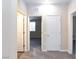 Neutral hallway with carpet, doors to bedrooms and bathrooms, and consistent interior design at 10956 Hunting Hawk Rd, Las Vegas, NV 89179