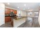 Open-concept kitchen features a large island, stainless steel appliances, and elegant granite countertops at 10956 Hunting Hawk Rd, Las Vegas, NV 89179