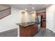 Kitchen with stainless steel appliances, granite countertops, and wood-look floors at 10956 Hunting Hawk Rd, Las Vegas, NV 89179
