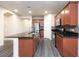 Modern kitchen boasts stainless steel appliances, granite countertops, and wood-look floors at 10956 Hunting Hawk Rd, Las Vegas, NV 89179