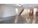 Open-concept living space features wood-look floors and staircase to the upper level at 10956 Hunting Hawk Rd, Las Vegas, NV 89179