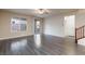 Open living area with wood-look floors, ceiling fan, and sliding door access to backyard at 10956 Hunting Hawk Rd, Las Vegas, NV 89179